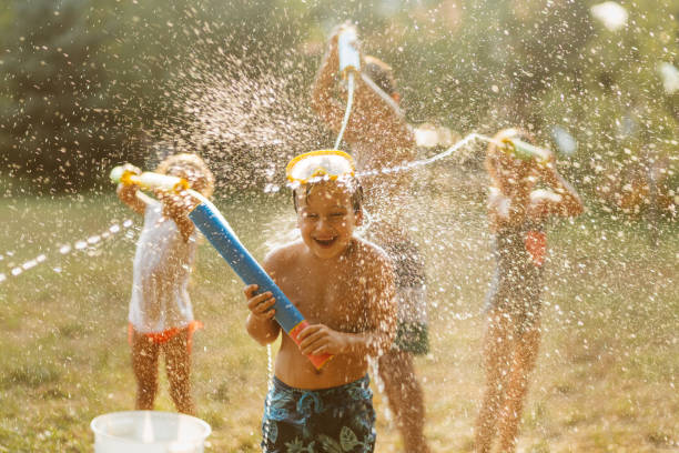 istock Children having a water fight on a hot summer day 2020708815