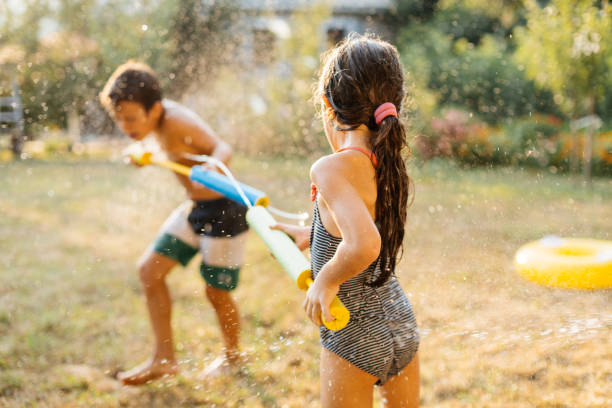 istock Children having a water fight on a hot summer day 2020710438
