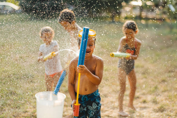 istock Children having a water fight on a hot summer day 2020711022
