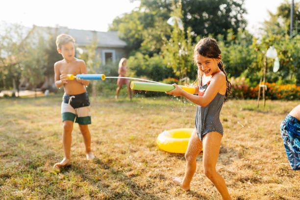 istock Children having a water fight on a hot summer day 2020713201