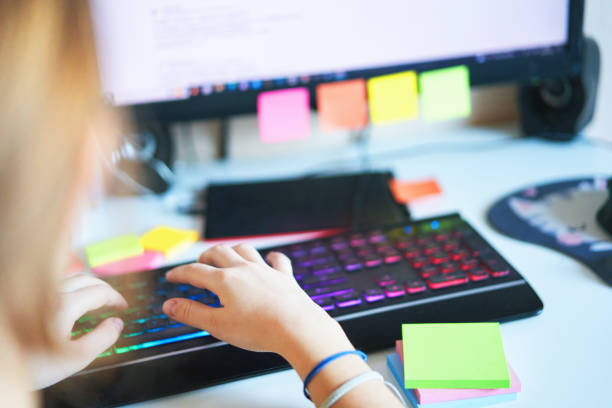 istock Young Girl Writing Post-Its for her School Project at Home 2020721403