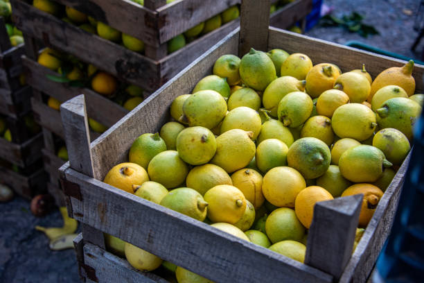 istock Lemons in crates at the market 2020729886