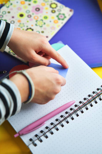 istock Young Girl Writing To-Do-List with Post-Its 2020734673