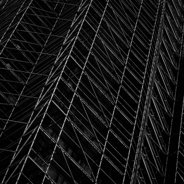 istock Low key shot of scaffolding on a construction site 2020737848
