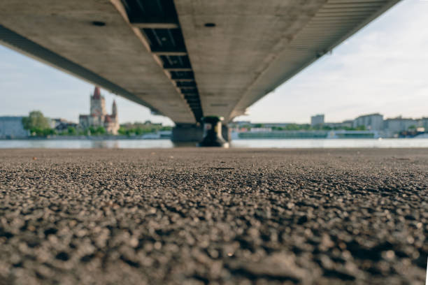 View from below a bridge to the blurred silhouette of a castle