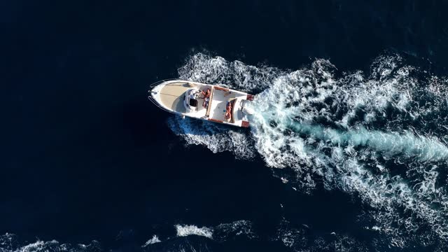 floating boat on blue Adriatic sea
