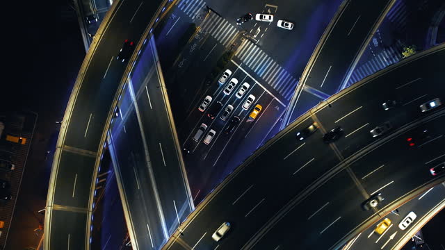T/L Drone Point View of Overpass and City Traffic at Night