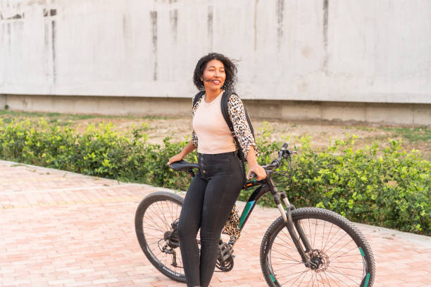 istock Confident Woman with Bicycle on City Path 2020751846