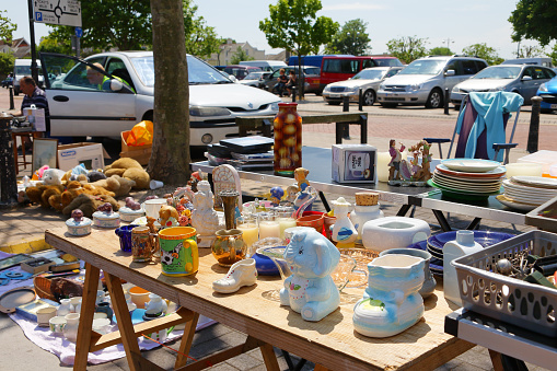 Chichester, England, UK - June 6, 2010: Many items were displayed for sale at one of the stalls during the outdoor flea market in the town.