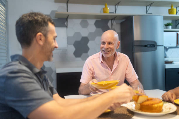 istock Father with children eating a meal at home 2020780806