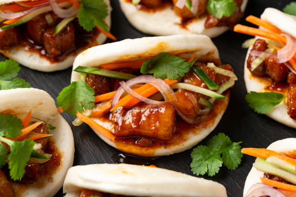 istock Bao buns with pork belly and vegetable. Asian cuisine 2020782446