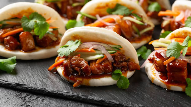 istock Bao buns with pork belly and vegetable. Asian cuisine 2020782969