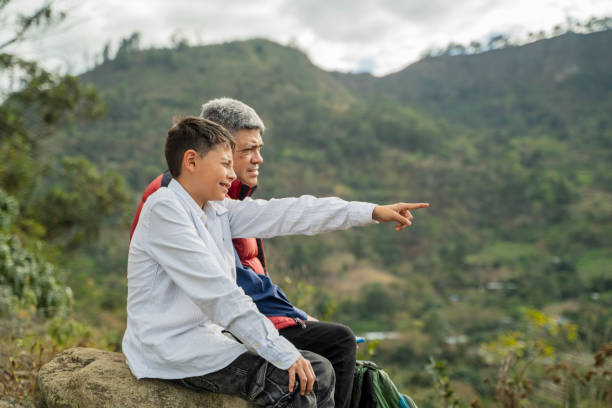 istock grandfather and grandson looking at the horizon 2020791686