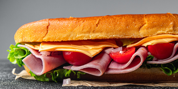 ham sandwich sliced meat, cheese, lettuce, tomato, vegetables, bun bread fresh food tasty fresh healthy eating cooking appetizer meal food snack on the table copy space food background rustic top view