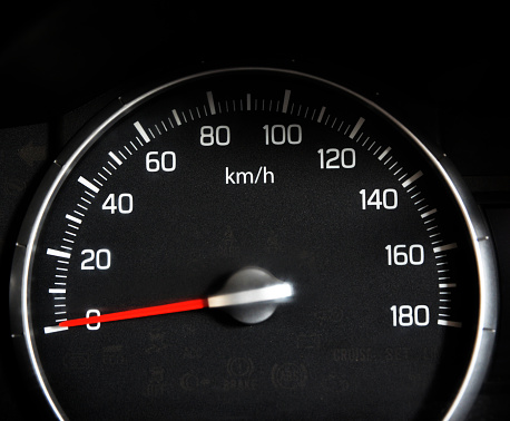 Speedometer closeup background with engine off and needle on zero. Car speedometer in black color