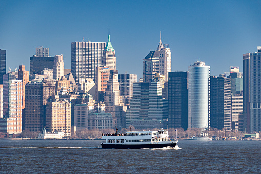 Panoramic view of Midtown Manhattan at dusk, office buildings in financial district, Hudson river, New York City, horizontally stitched composition, America, USA.