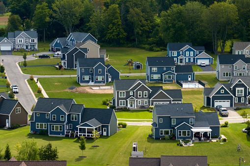 Aerial view of large private homes in Rochester, NY residential area. New family houses as example of real estate development in american suburbs.