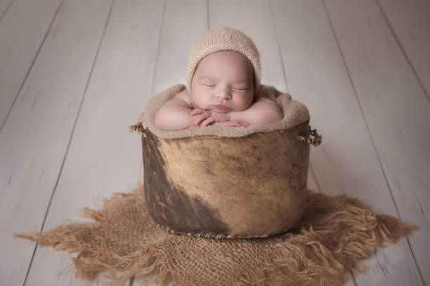 istock Newborn baby boy sleeping in a bucket 2020860366