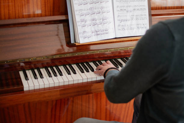istock a young man plays the piano 2020870651