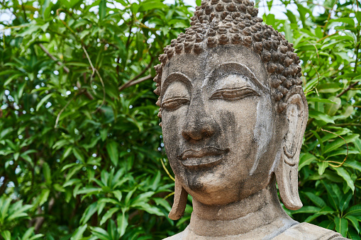 Detail of ancient Buddha statue at Yai Chai Mongkhon temple. Ayutthaya. Phra Nakhon Si Ayutthaya province. Thailand.