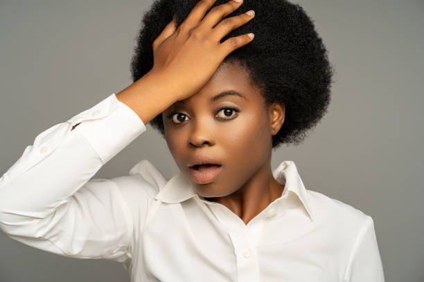 istock Forgetful black woman touching head with shocked amazed face expression, remembering forgotten thing 2020894483