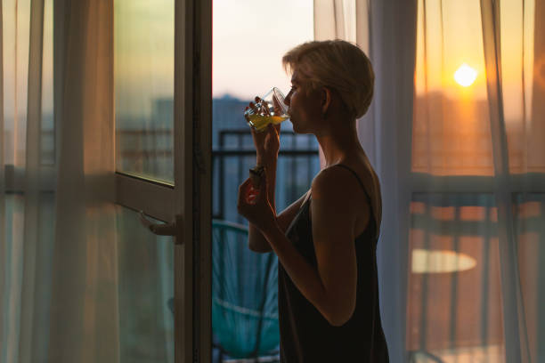Blonde woman near window. Morning