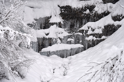 The Diesbachfall is a beautiful large waterfall in the Canton of Glarus. The Diesbachfall is one of few waterfalls which are in nearly original condition and not full used for generating water energy. The image was captured when the Waterfall was partially frozen in winter.