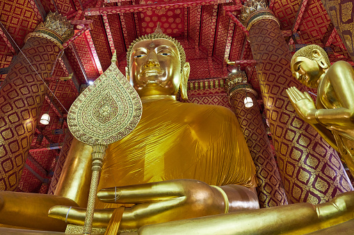 Ancient gilded Buddha statue at Phanan Choen temple. Ayutthaya. Phra Nakhon Si Ayutthaya province. Thailand.