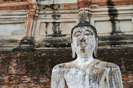 Detail of ancient Buddha statue at Yai Chai Mongkhon temple. Ayutthaya. Phra Nakhon Si Ayutthaya province. Thailand.