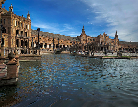 wide angle view of the Plaza de Espana,  part of the Maria Luisa Park, in the historic downtown district of Seville, Spain