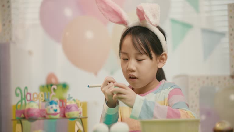 young girl was making Easter craft and decorations at home