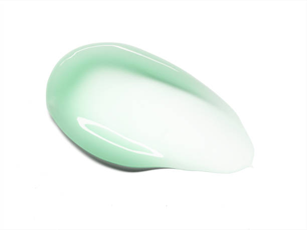 istock Green moisturizer gel texture stroke isolated on white background. Cosmetic anti aging skincare product 2021020344