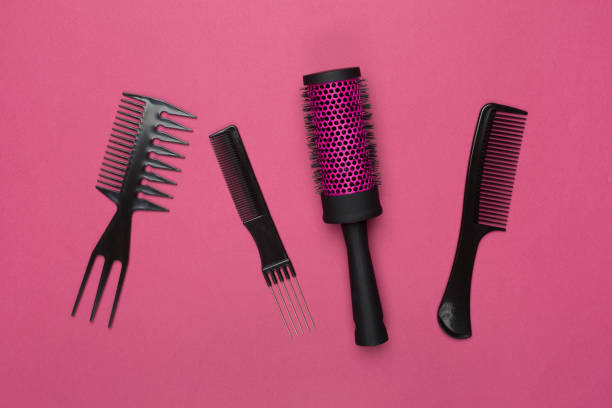 istock Professional combs and hairdresser tools on color background, top view 2021063280