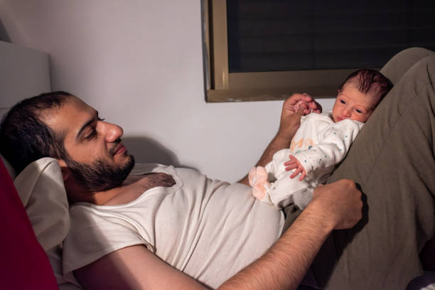 istock baby wake up during night and prevent parents from getting some sleep 2021074300