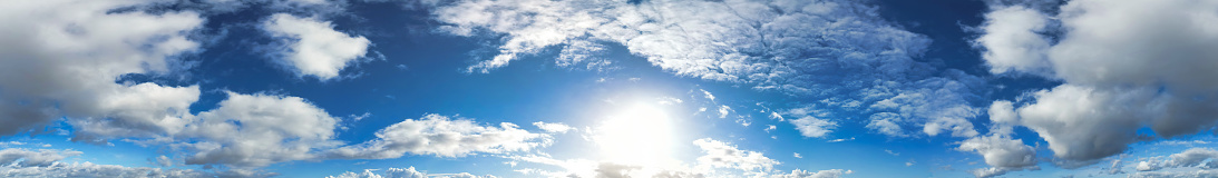 Super high-resolution blue sky panorama with fluffy white clouds.