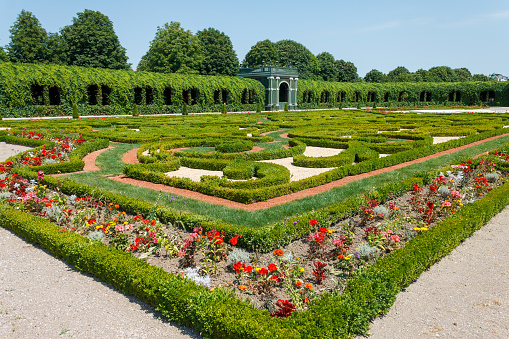 The blooming symmetric crown gardens of the summer Schönbrunn palace in Vienna, Austria.