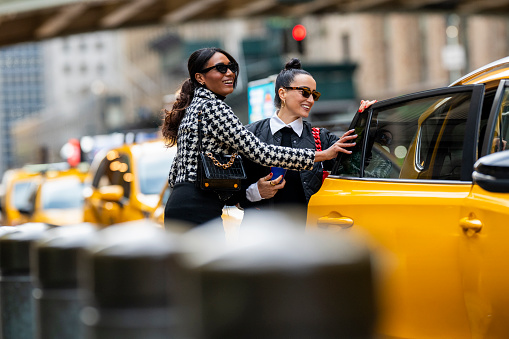 Yellow cab speeds through Times Square in New York, NY, USA.