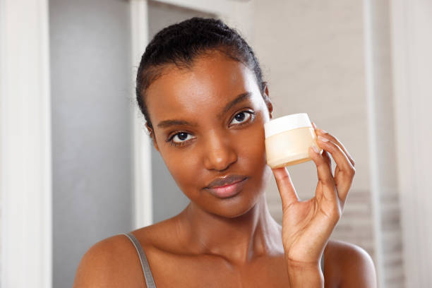 istock Fierce Beautiful Black Woman Holding A Cream 2021125929