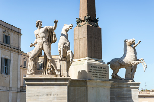 Montpellier, France - October 27, 2021: View of the equestrian statue of of Louis XIV and Le Château d'Eau in  the public park Jardin de Peyrou in Montpellier, France.