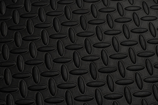 Black background of protective floor mat made of eva foam.