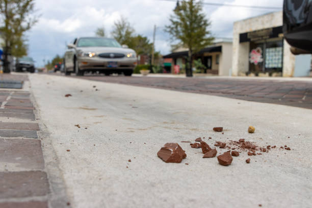 istock Crumbling road with cars 2021210790