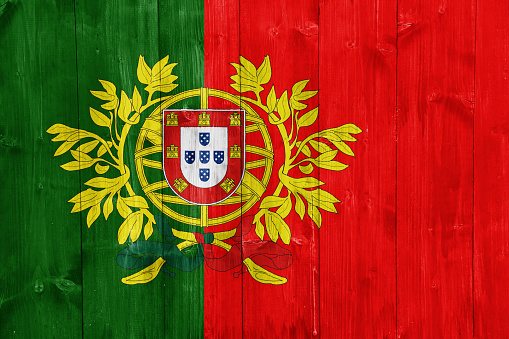Flag and coat of arms of Portuguese Republic on a textured background. Concept collage.