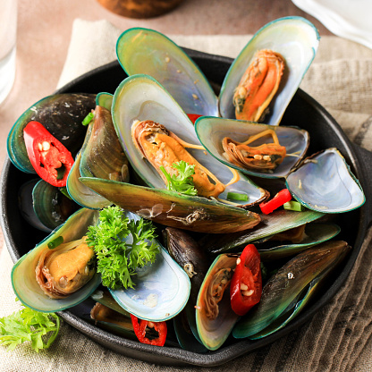 Delicious Asian Style Steamed Mussels with Red Pepper, Green Onion, Turmeric, and Garlic