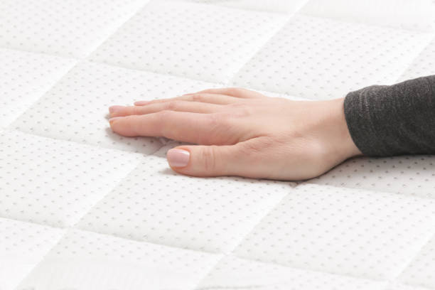 istock Woman press on comfortable mattress, checking and testing quality 2021266583