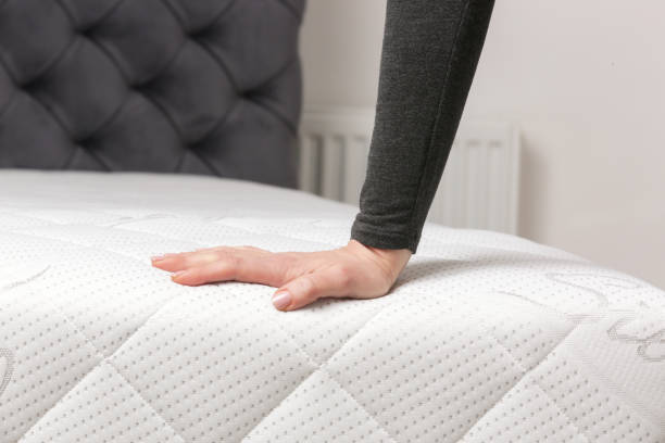 istock Woman press on comfortable mattress, checking and testing quality 2021268133