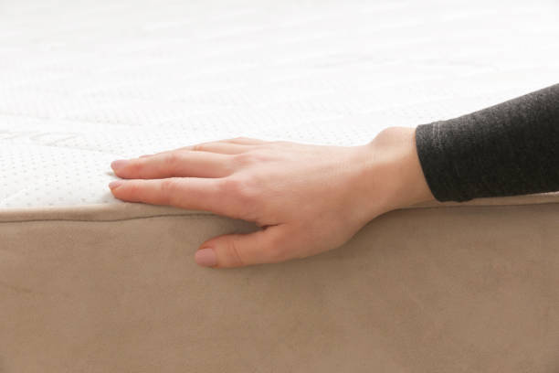 istock Woman press on comfortable mattress, checking and testing quality 2021268134
