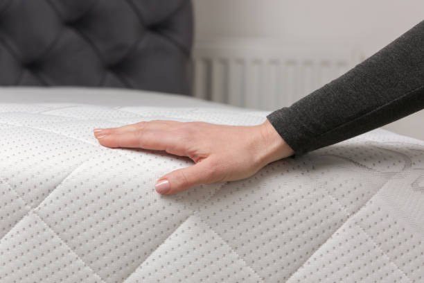 istock Woman press on comfortable mattress, checking and testing quality 2021275388