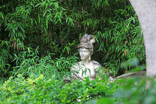 Beautiful lady sculpture in peony flowers, Beijing Botanical Garden