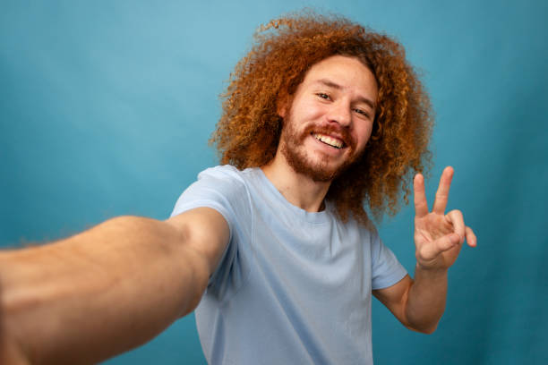 istock Man Taking a Selfie with Peace Sign 2021313916