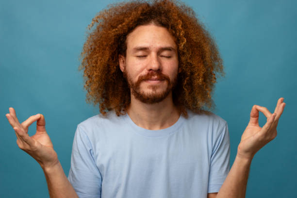 istock Man in Meditation Pose with Eyes Closed 2021325875